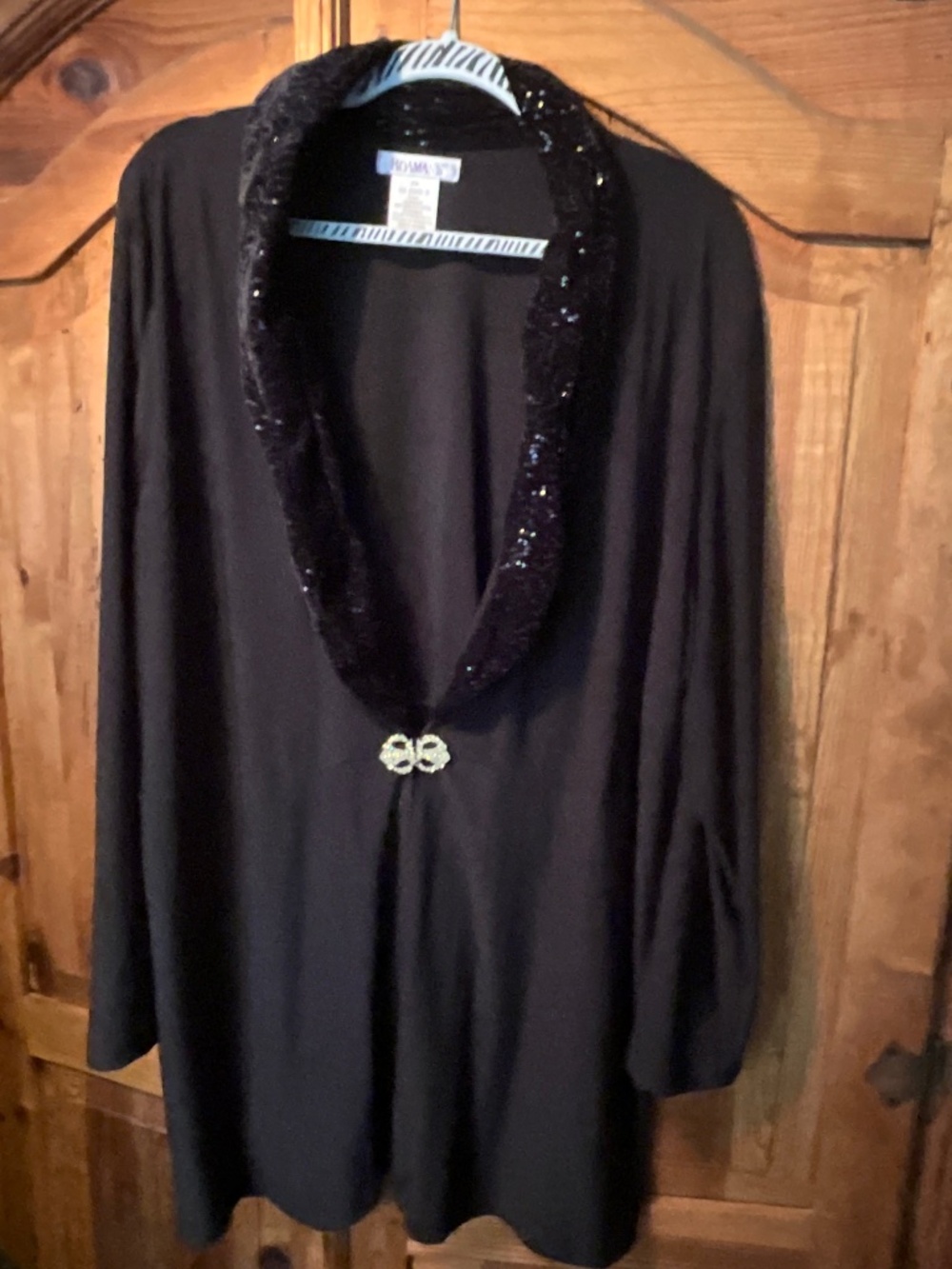 Formal black sequined suit with rhinestone clip on front of jacket.